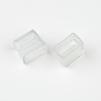 UCW-N02 CLEAR 025 POLYBAG Изолирующий зажим заглушка для светодиодных лент ULS-N02 NEON 12В. 13x26мм. Цвет прозрачный. 25 штук в пакете. TM Uniel