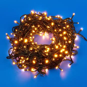 ULD-S5000-500-DGA WARM WHITE IP20 Гирлянда светодиодная. 50м. 500 светодиодов. Теплый белый свет. Провод зеленый. ТМ Uniel